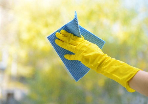 Cleaner preparing carpet cleaning equipment before a job