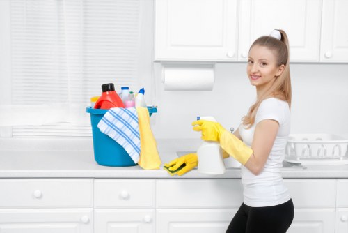 Carpet cleaning professional preparing equipment for a booked service