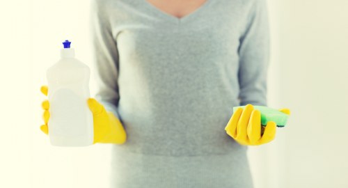Vacuuming a mattress to remove dust and allergens