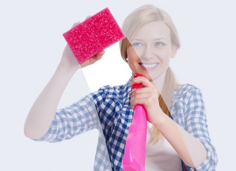 Cleaner wearing PPE while working on carpet maintenance